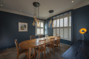 Dining Room Tier on Tier Box Bay Window Shutters Installed By The Great Shutter Co.